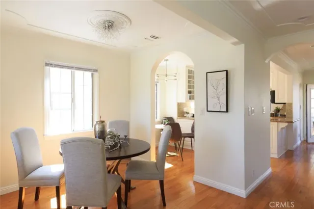 a large kitchen with stainless steel appliances kitchen island granite countertop a large counter top a stove and a sink