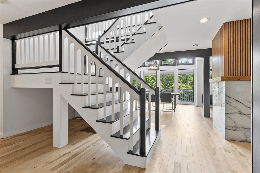 7 Birch Hill Road Pepperell, MA 01463 - Photo 11 of 42 a view of entryway with wooden floor and stairs