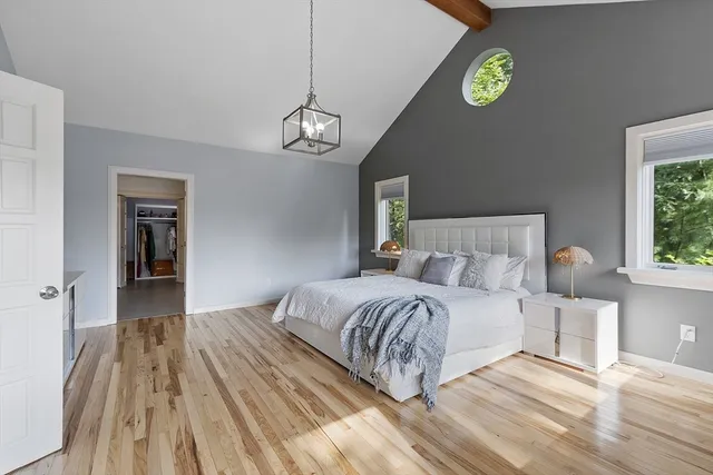 a bathroom with a white tub shower and toilet