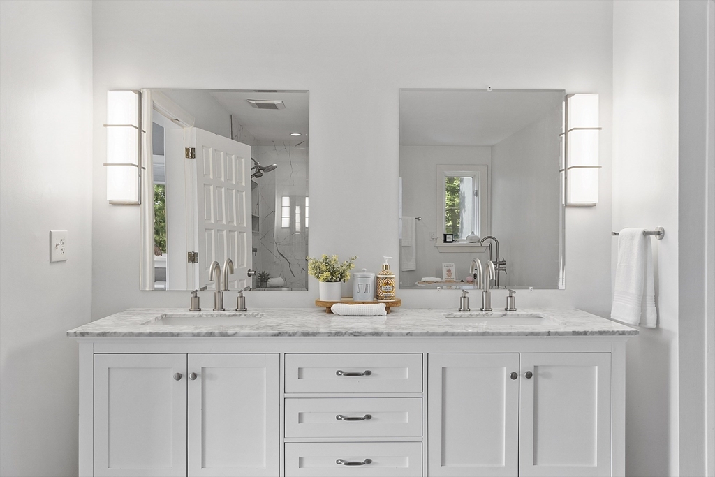 7 Birch Hill Road Pepperell, MA 01463 - Photo 24 of 42 a bathroom with double sink and a mirror