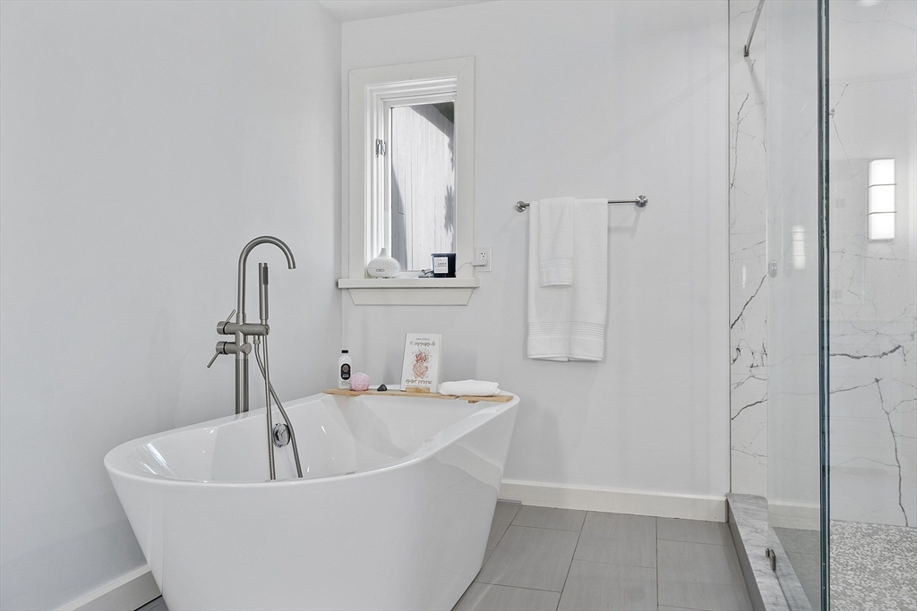 7 Birch Hill Road Pepperell, MA 01463 - Photo 25 of 42 a white bath tub sitting in a bathroom