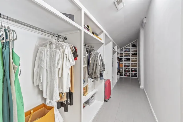 a bedroom with a bed and a table