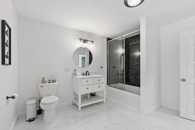 a bedroom with a bed and a walk in closet