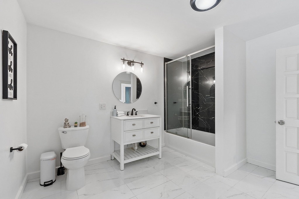 7 Birch Hill Road Pepperell, MA 01463 - Photo 29 of 42 a bathroom with a toilet sink a shower and