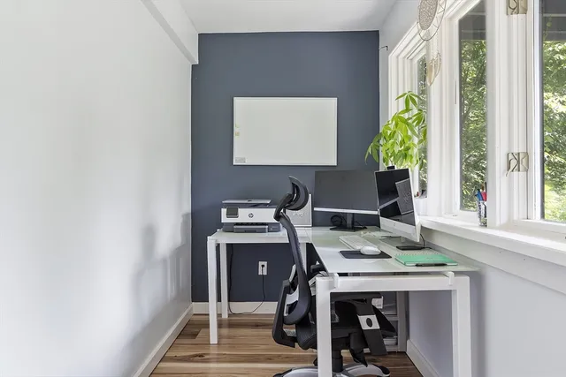 a bedroom with a bed a desk and chair