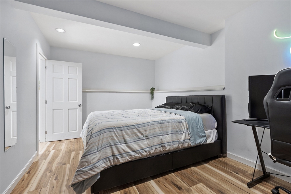 7 Birch Hill Road Pepperell, MA 01463 - Photo 35 of 42 a bedroom with a bed a desk and chair