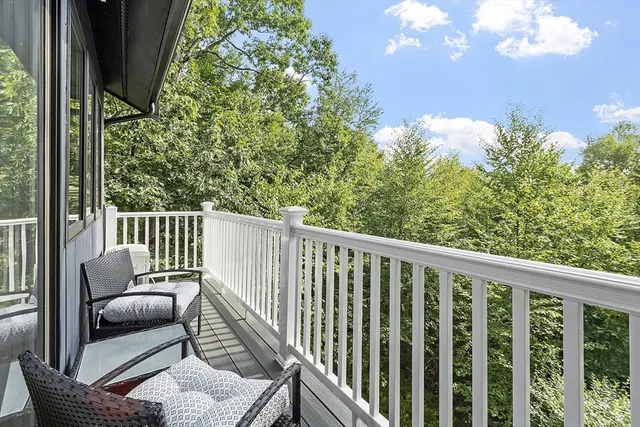 a view of a patio with couches table and chairs and potted plants
