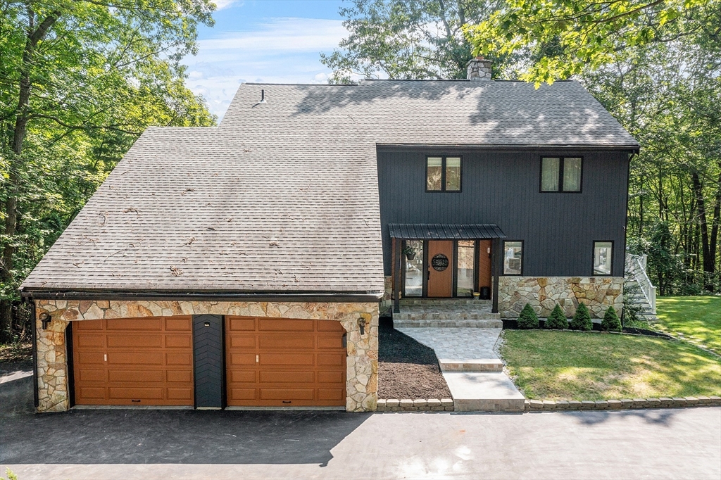 7 Birch Hill Road Pepperell, MA 01463 - Photo 38 of 42 a front view of a house with a garden