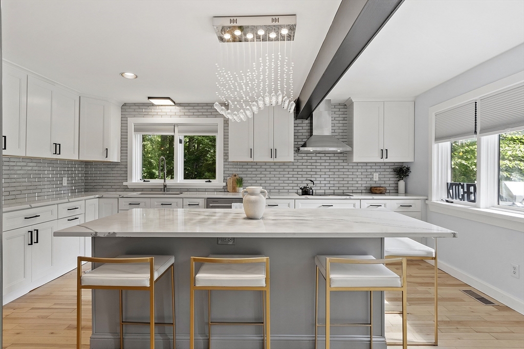 7 Birch Hill Road Pepperell, MA 01463 - Photo 7 of 42 a kitchen with stainless steel appliances granite countertop a table chairs sink and cabinets