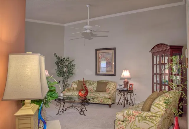 a living room with furniture and a lamp