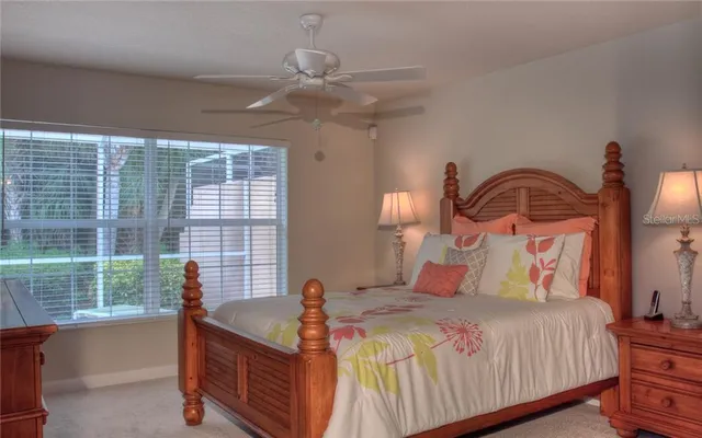 a bedroom with bed and window