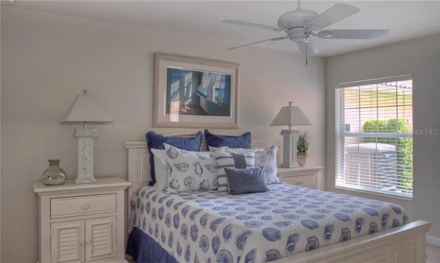 a bedroom with a large bed and a window