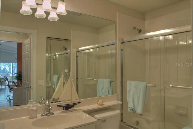 a bathroom with a sink a mirror and a shower