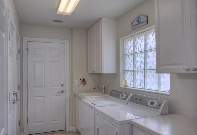a bathroom with a sink and a window