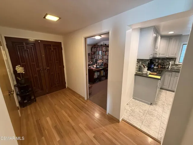 a view of a kitchen from the hallway