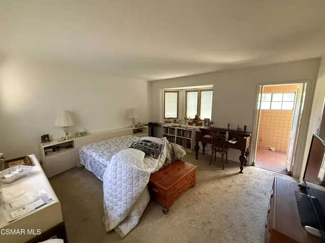 a bed room with a bed and a couch