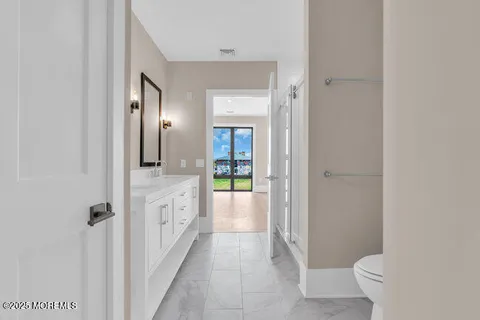 a spacious bathroom with a sink and a toilet