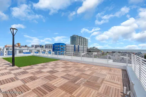 a view of a swimming pool with a yard