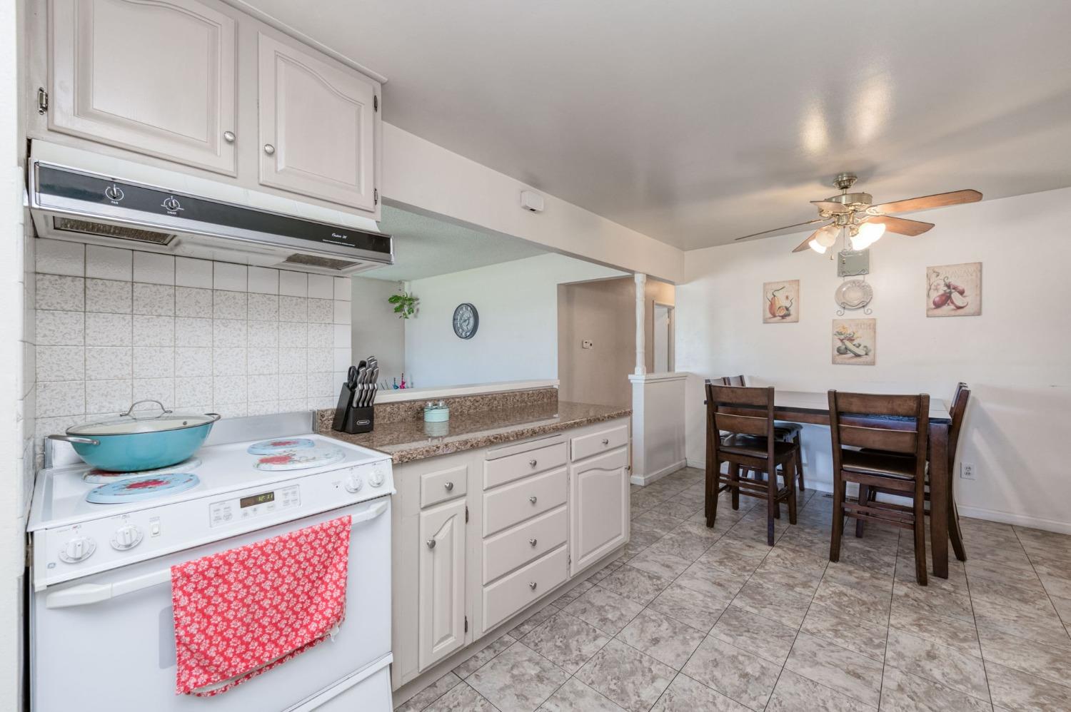 1325 Terry Avenue Clovis, CA 93612 - Photo 11 of 28 a kitchen that has a cabinets counter space and appliances