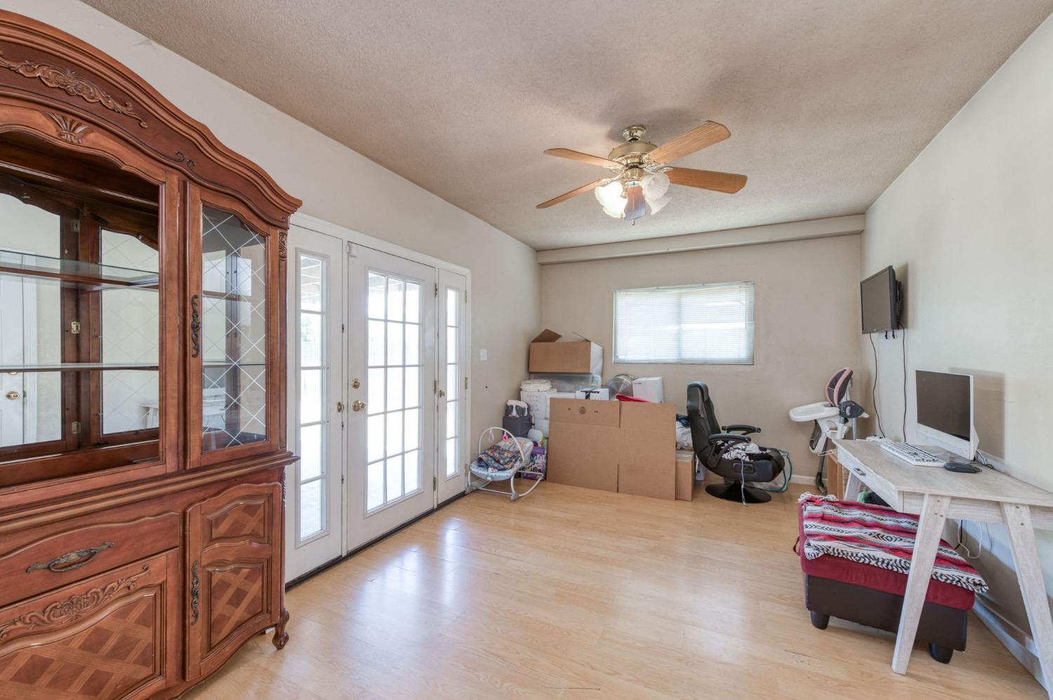 1325 Terry Avenue Clovis, CA 93612 - Photo 14 of 28 a living room with furniture fireplace and a flat screen tv