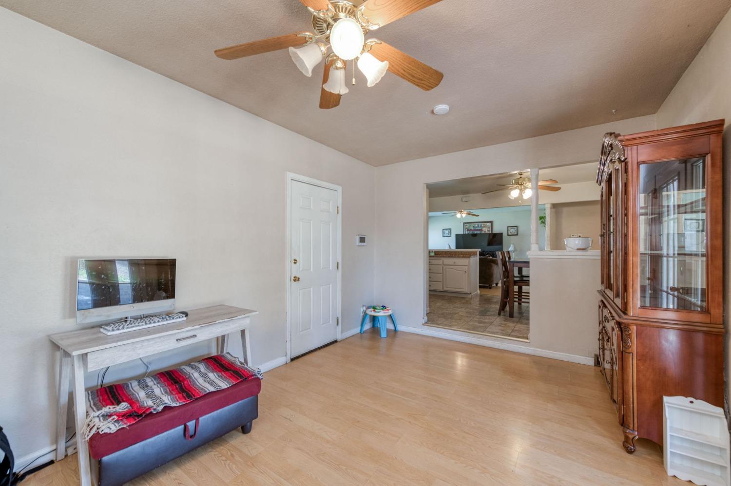 1325 Terry Avenue Clovis, CA 93612 - Photo 16 of 28 a living room with furniture and a flat screen tv