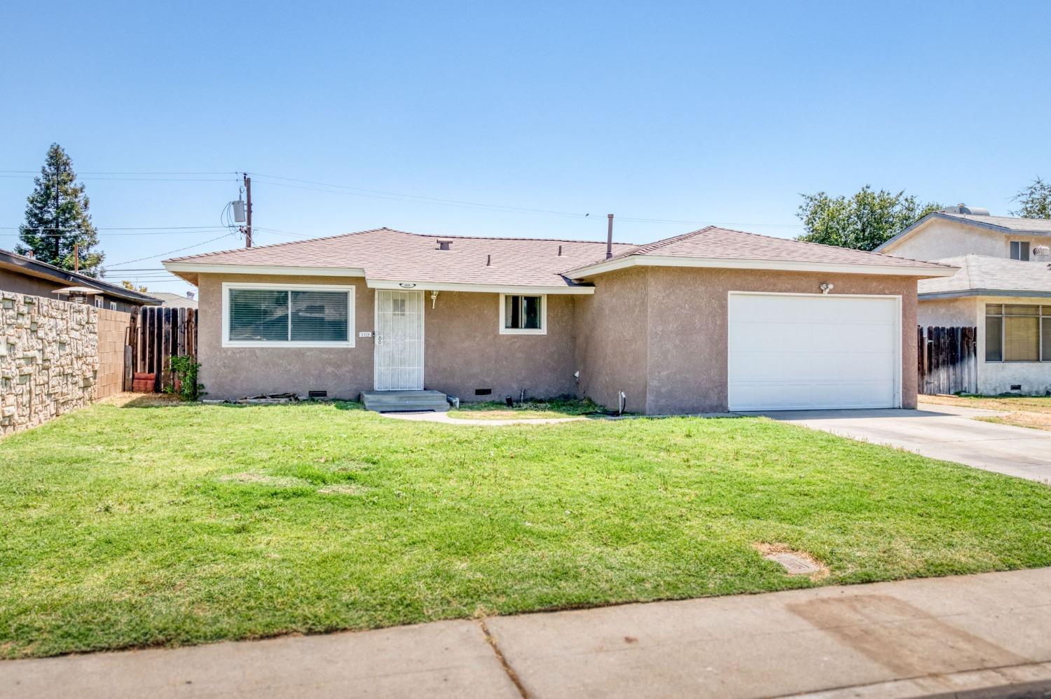 1325 Terry Avenue Clovis, CA 93612 - Photo 2 of 28 front view of house with a yard