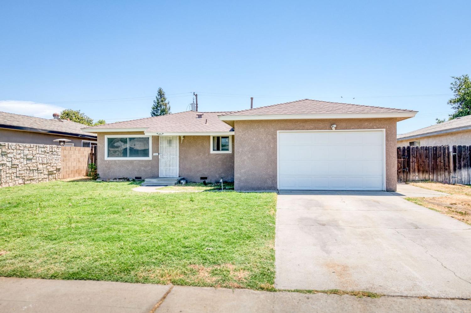 1325 Terry Avenue Clovis, CA 93612 - Photo 3 of 28 front view of a house with a yard