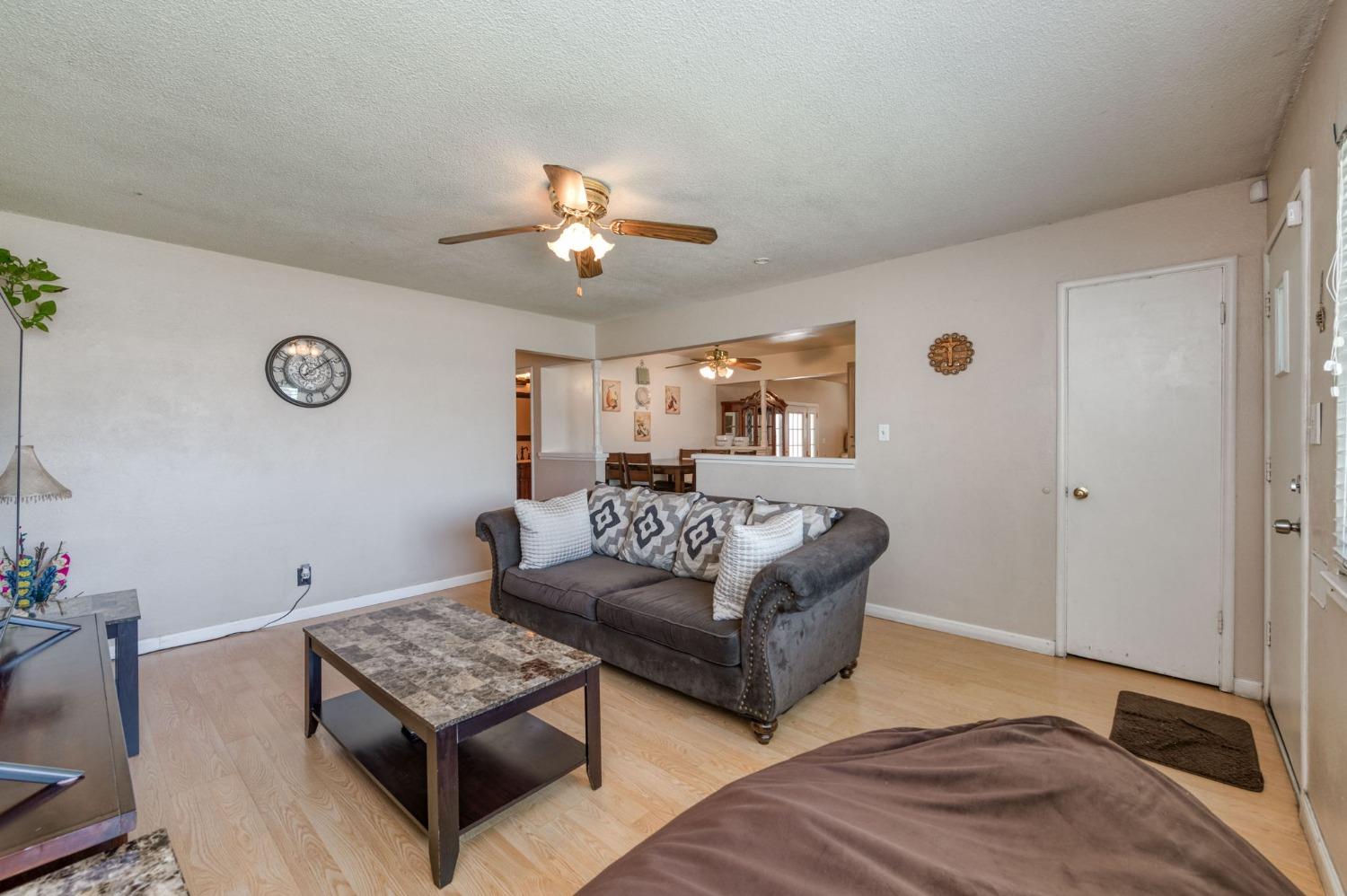 1325 Terry Avenue Clovis, CA 93612 - Photo 7 of 28 a living room with furniture and wooden floor