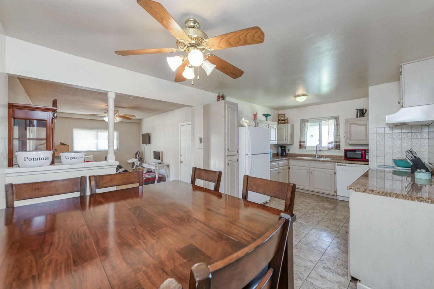 1325 Terry Avenue Clovis, CA 93612 - Photo 9 of 28 a large kitchen with a table and chairs