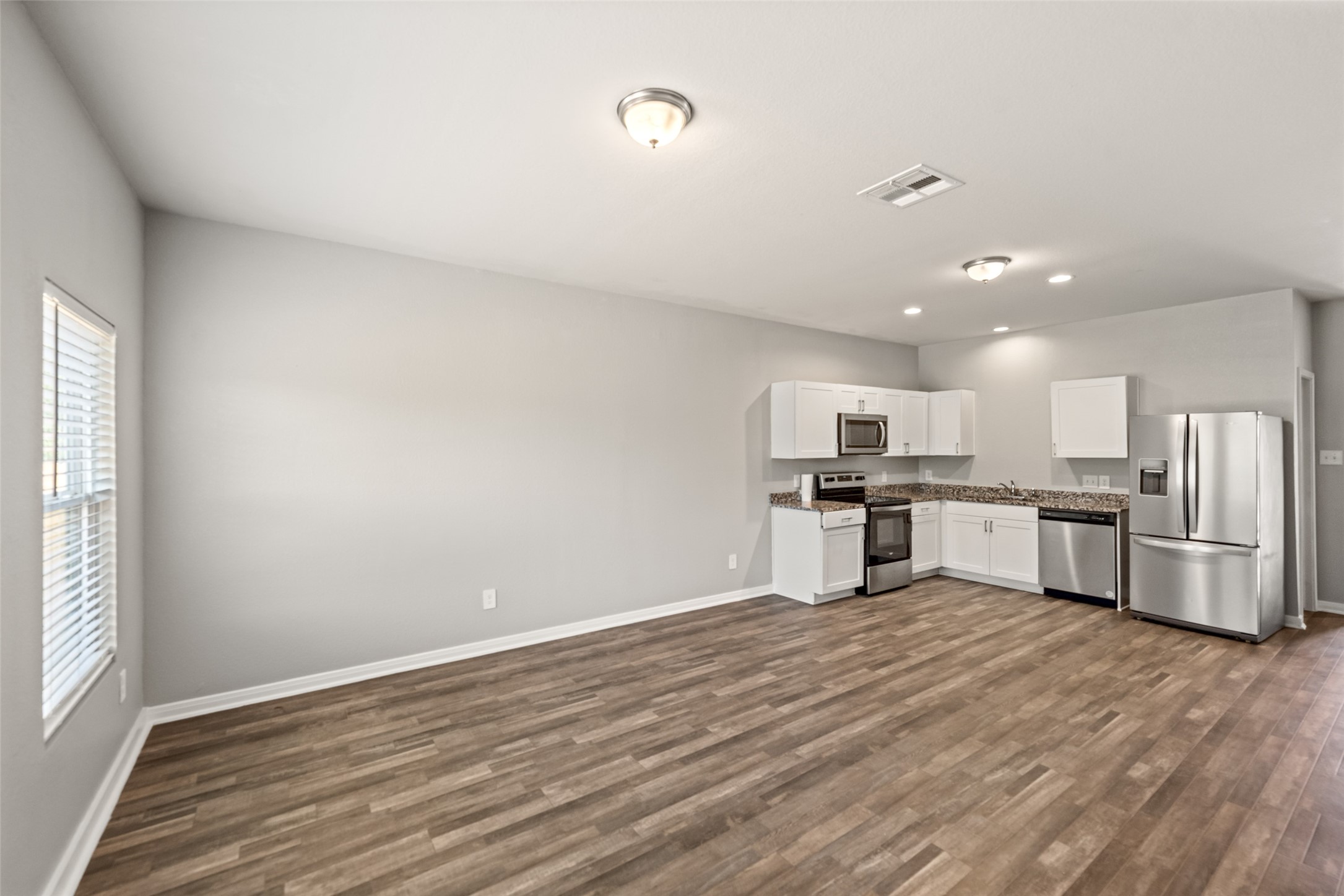 2537 18th Street Hempstead, TX 77445 - Photo 9 of 28 Open-concept living area with generous space for seating and a seamless connection to the kitchen and dining area