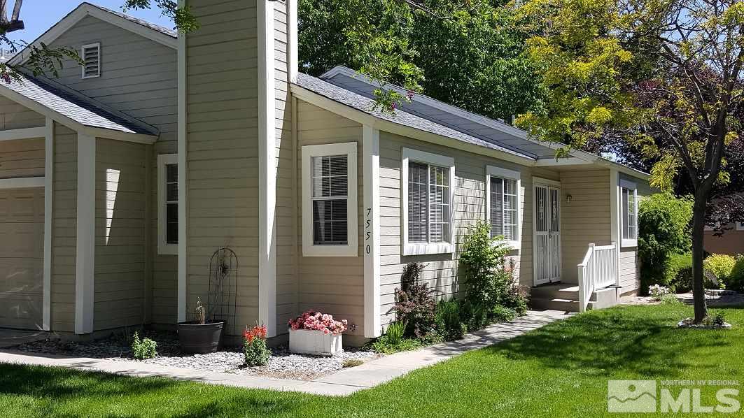 a front view of house with yard