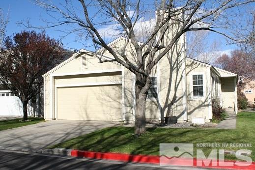 7550 Whimbleton Way Reno, NV 89511 - Photo 2 of 15 a front view of a house with garden