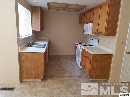 7550 Whimbleton Way Reno, NV 89511 - Photo 7 of 15 a utility room with a sink a washer and dryer