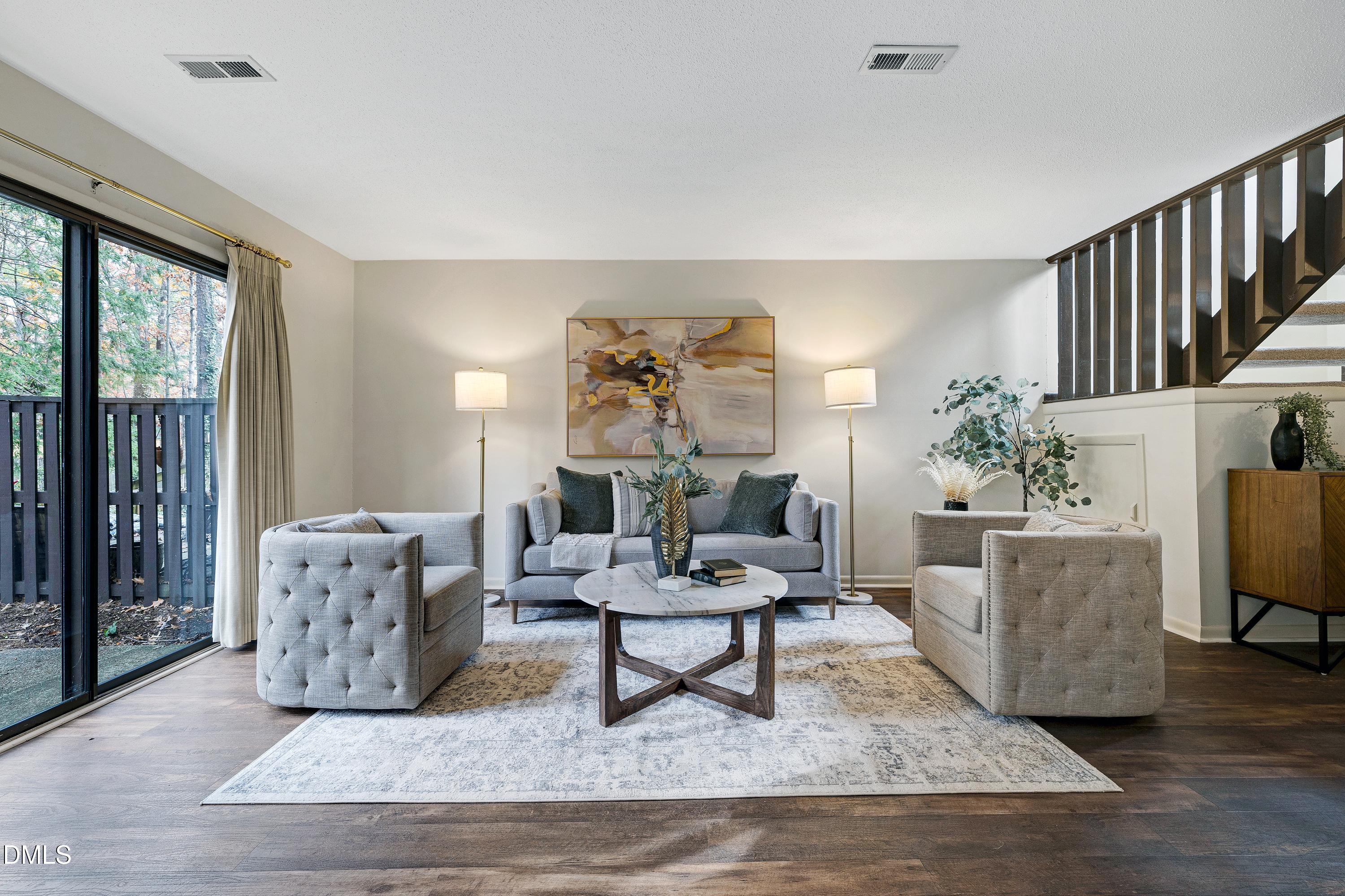 a living room with furniture and a rug
