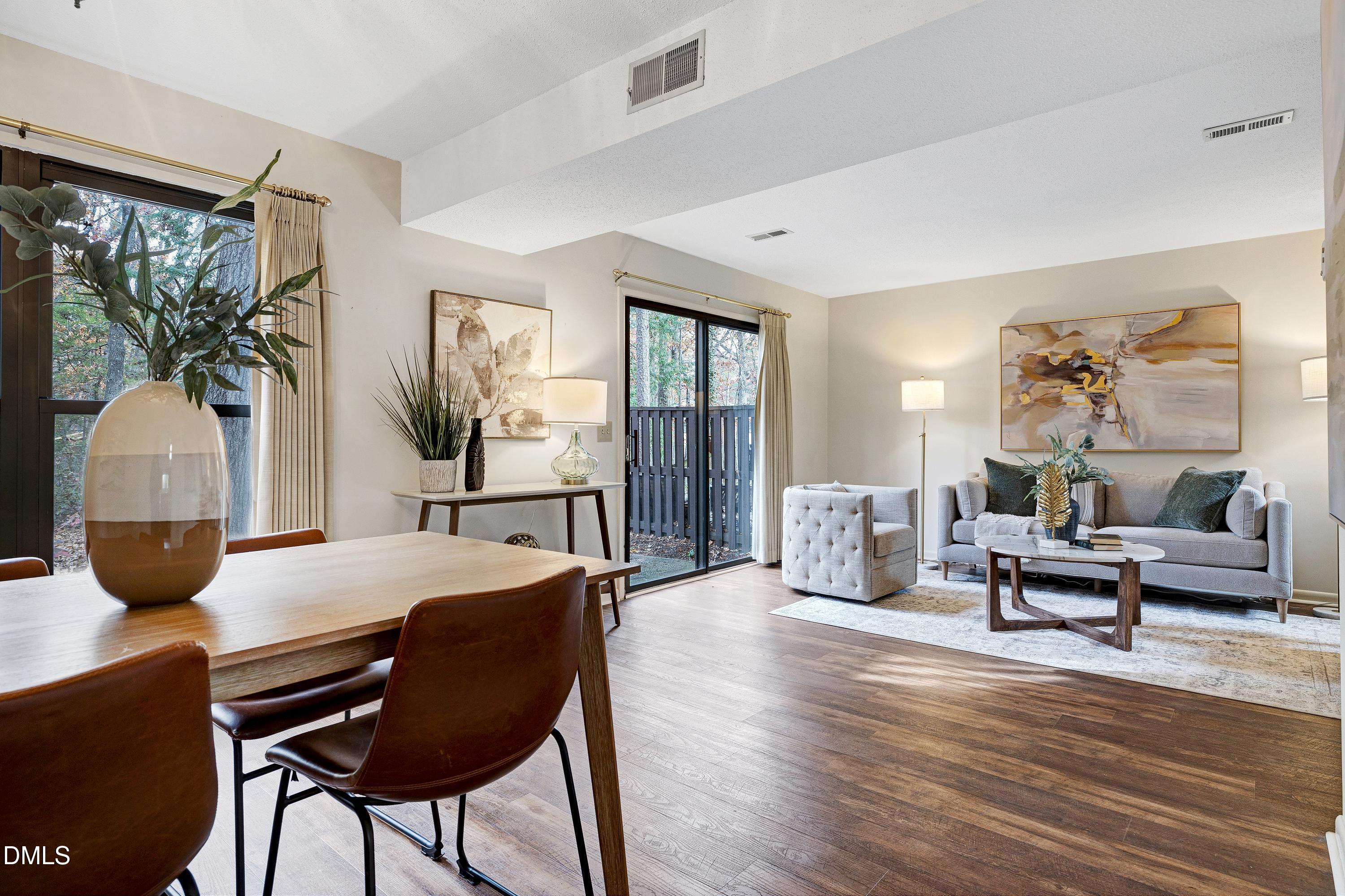 3905 Wendy Lane Raleigh, NC 27606 - Photo 9 of 42 a living room with furniture and a table