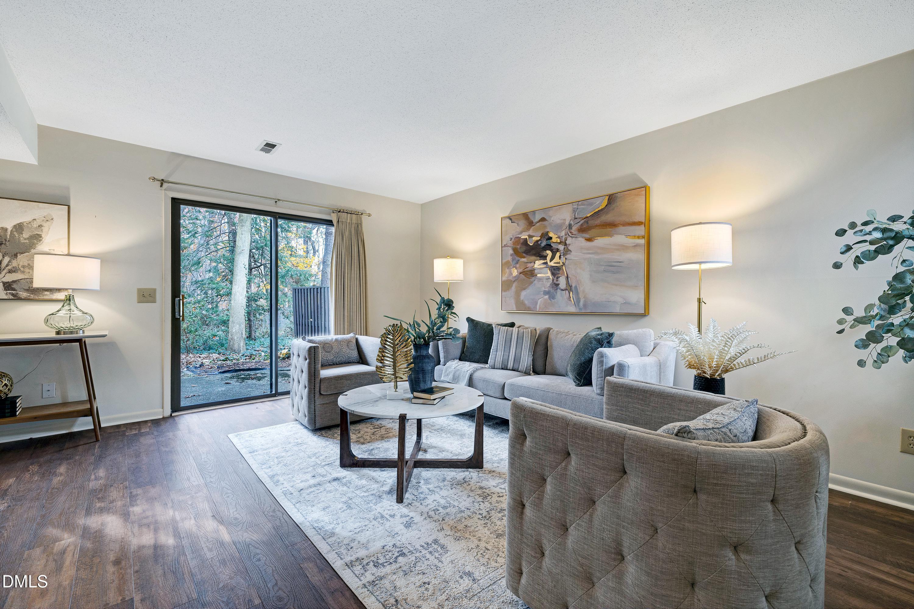 3905 Wendy Lane Raleigh, NC 27606 - Photo 10 of 42 a living room with furniture and a large window