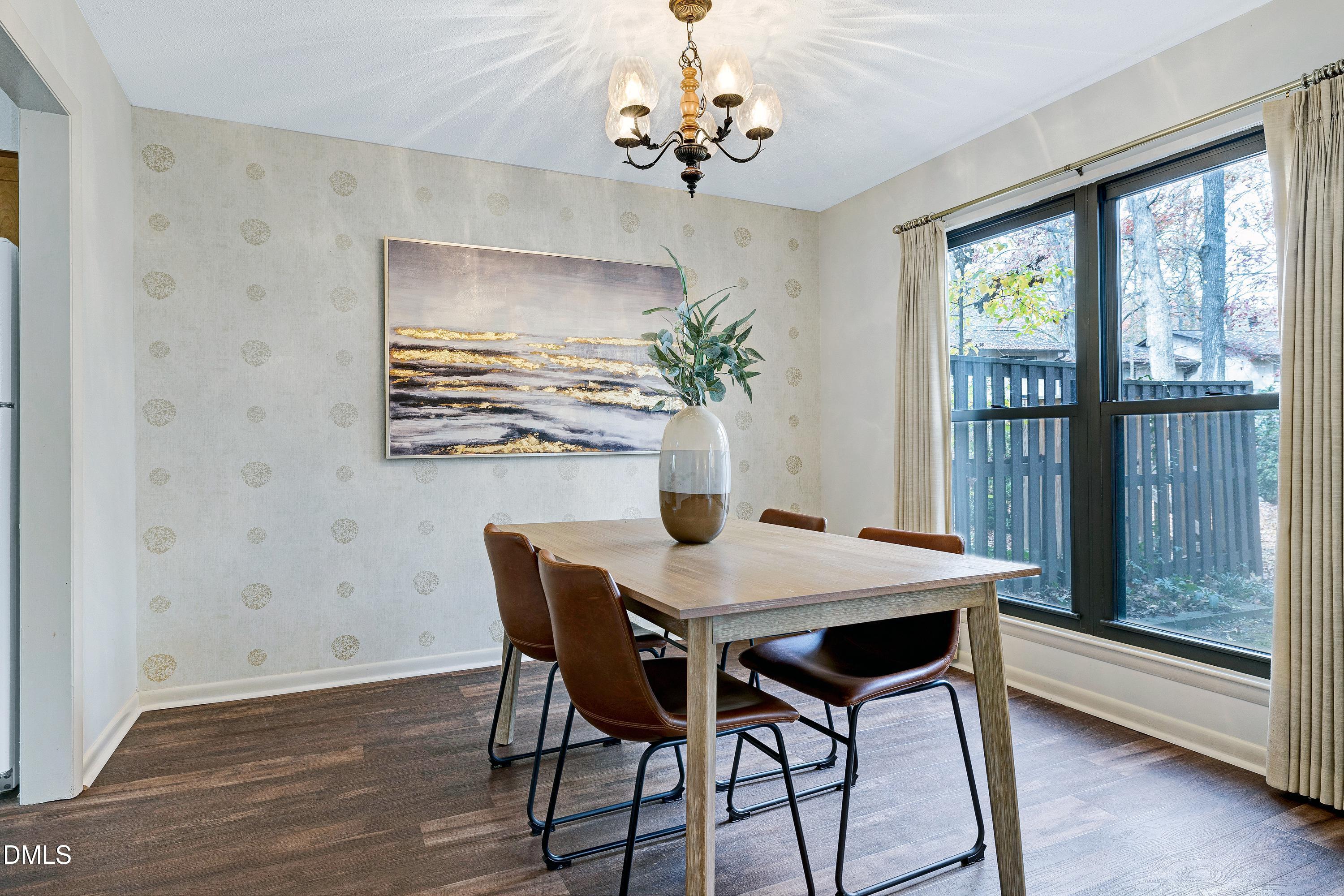 3905 Wendy Lane Raleigh, NC 27606 - Photo 12 of 42 a view of a dining room with furniture window and wooden floor