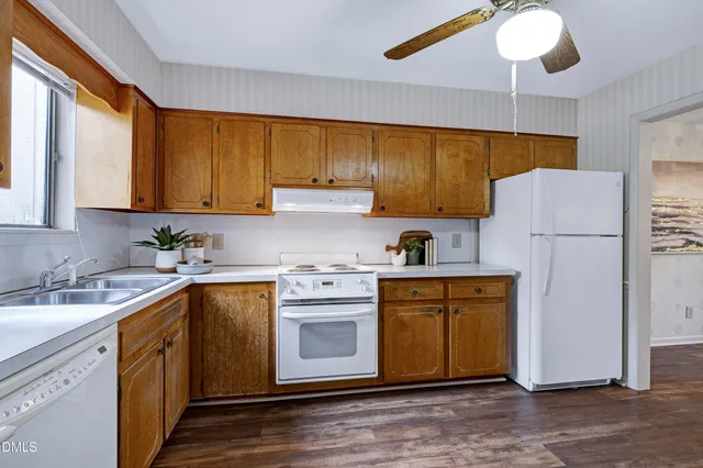 a view of a dining room with furniture wooden floor and a chandelier