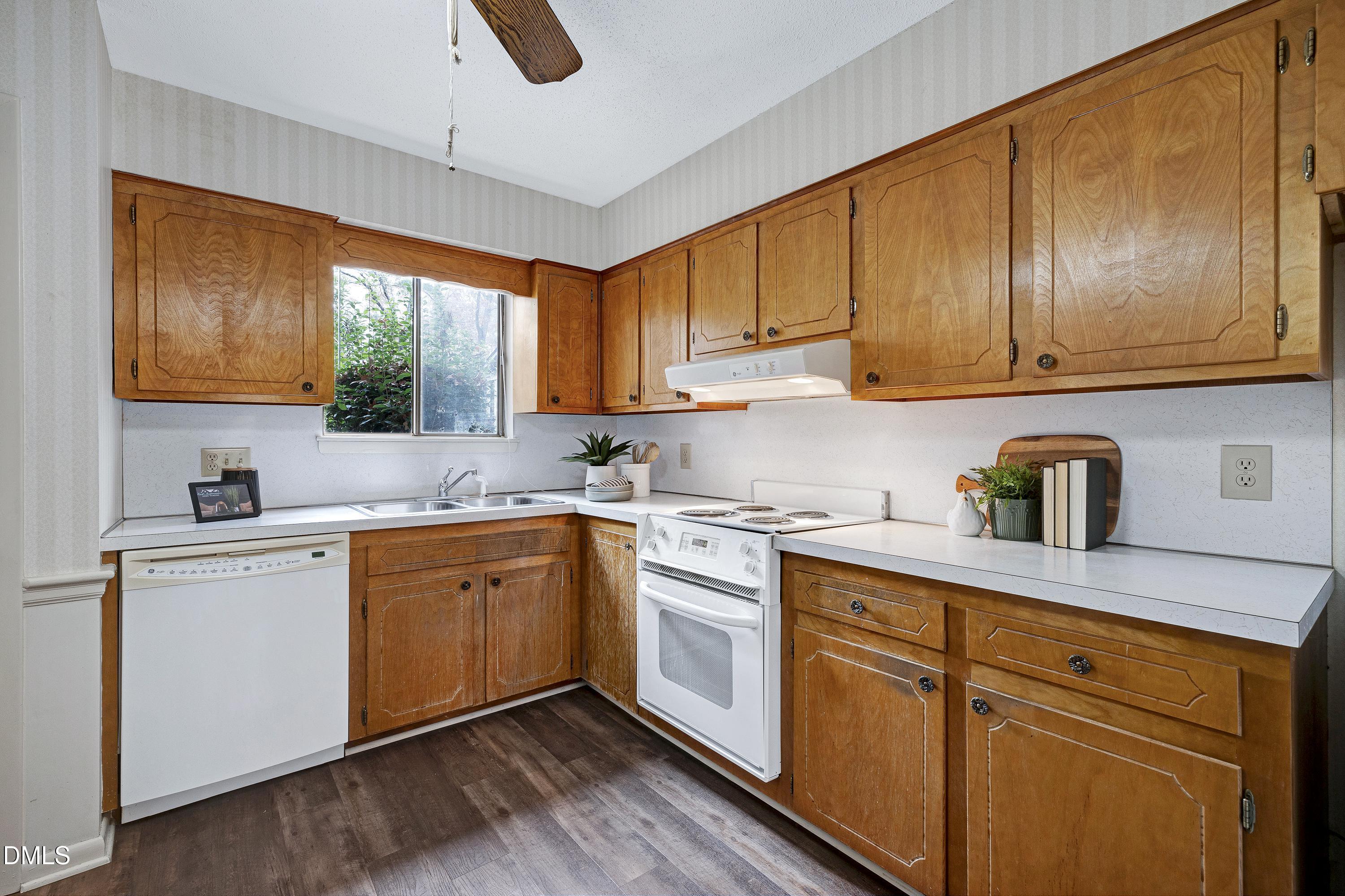 3905 Wendy Lane Raleigh, NC 27606 - Photo 17 of 42 a kitchen with sink cabinets and window