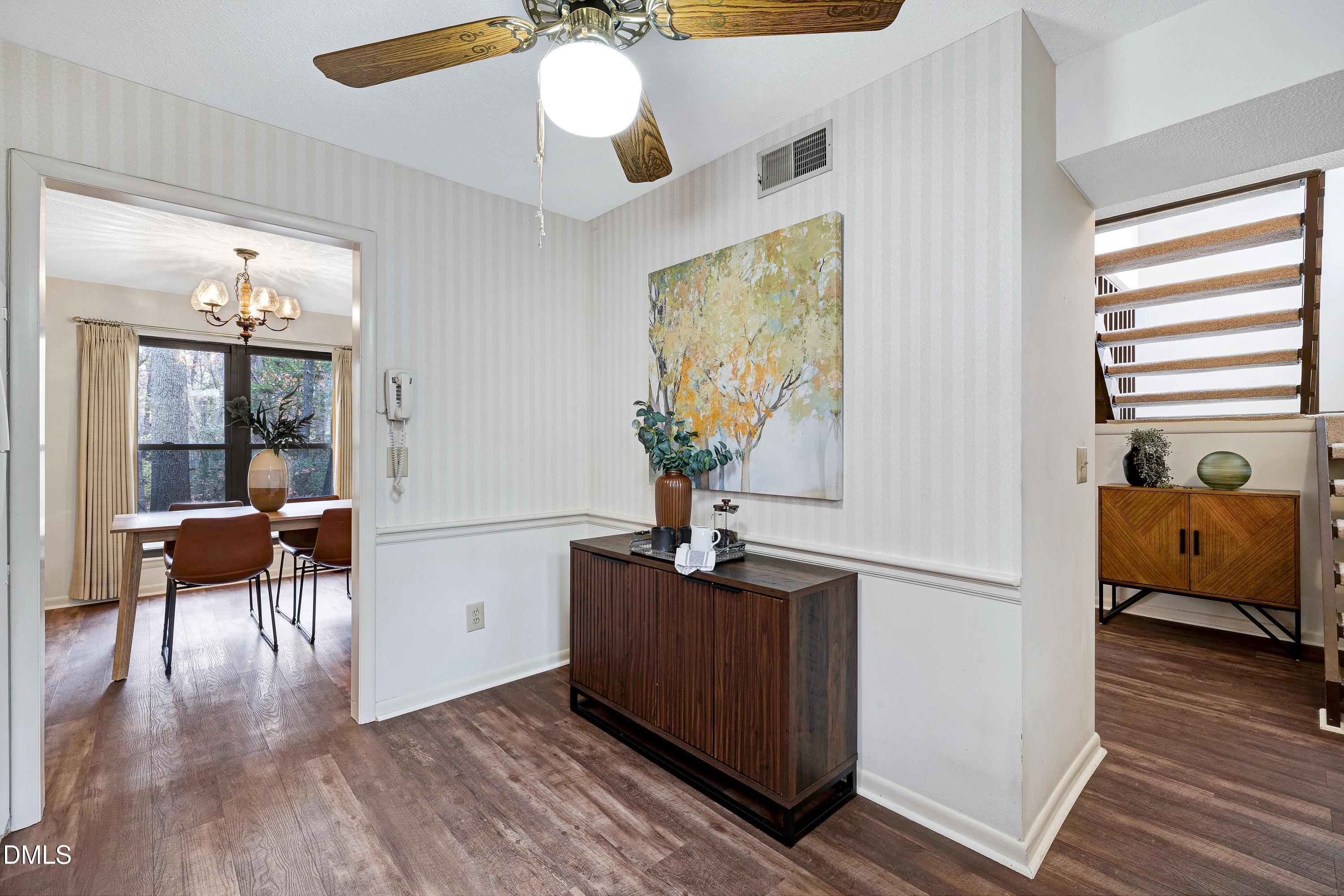 3905 Wendy Lane Raleigh, NC 27606 - Photo 18 of 42 a living room with furniture and a potted plant