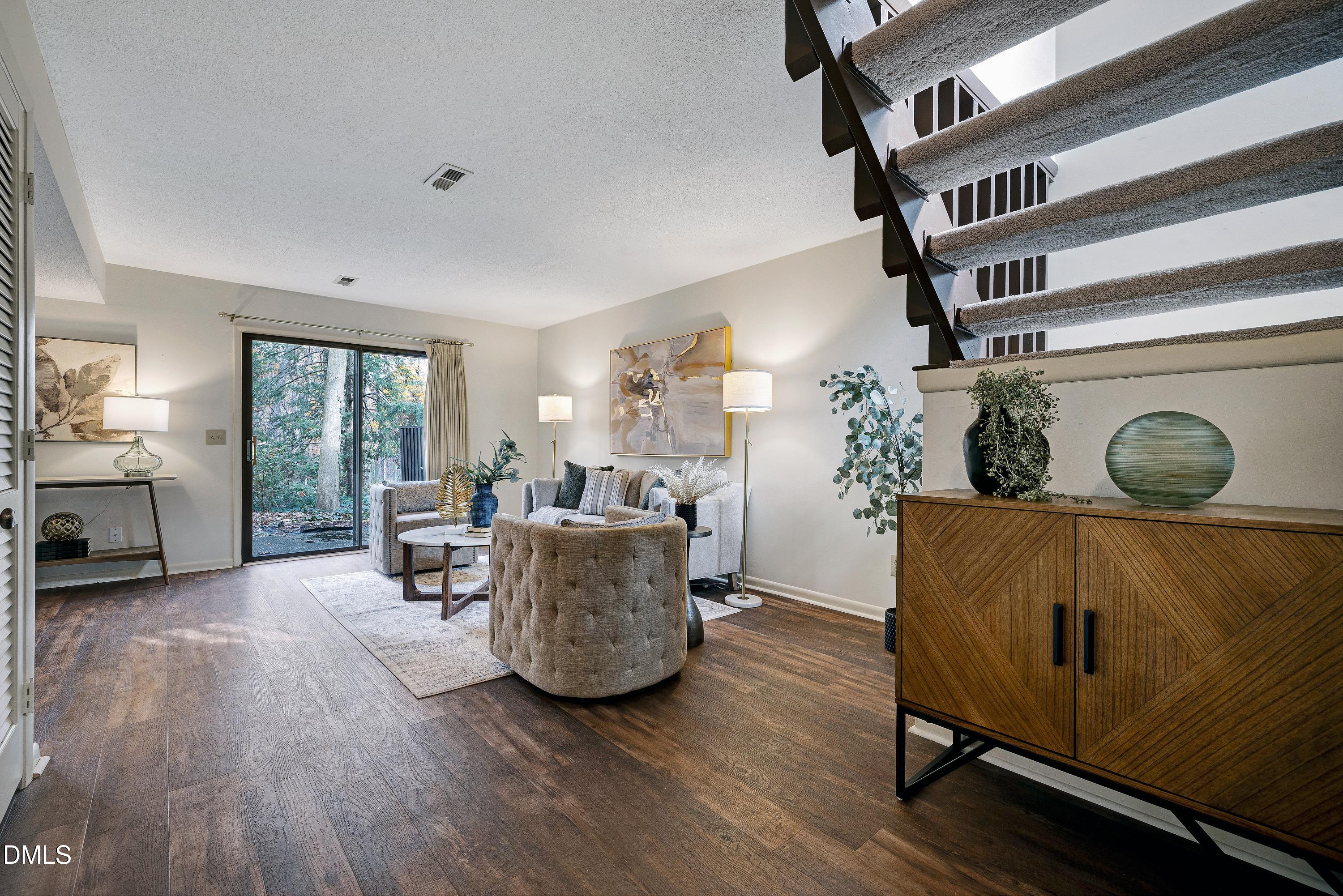 3905 Wendy Lane Raleigh, NC 27606 - Photo 21 of 42 a living room with furniture and a window
