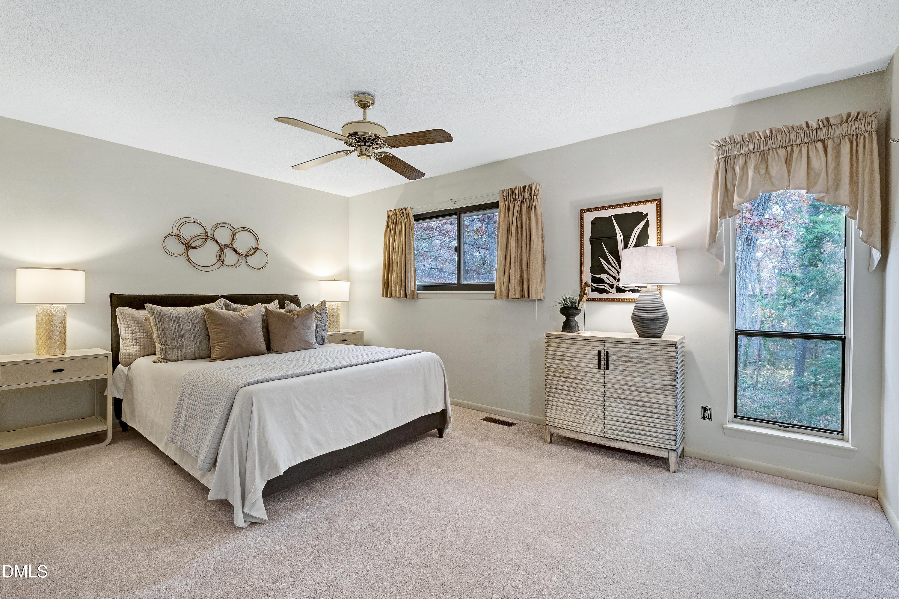 3905 Wendy Lane Raleigh, NC 27606 - Photo 22 of 42 a bed room with a bed and a window