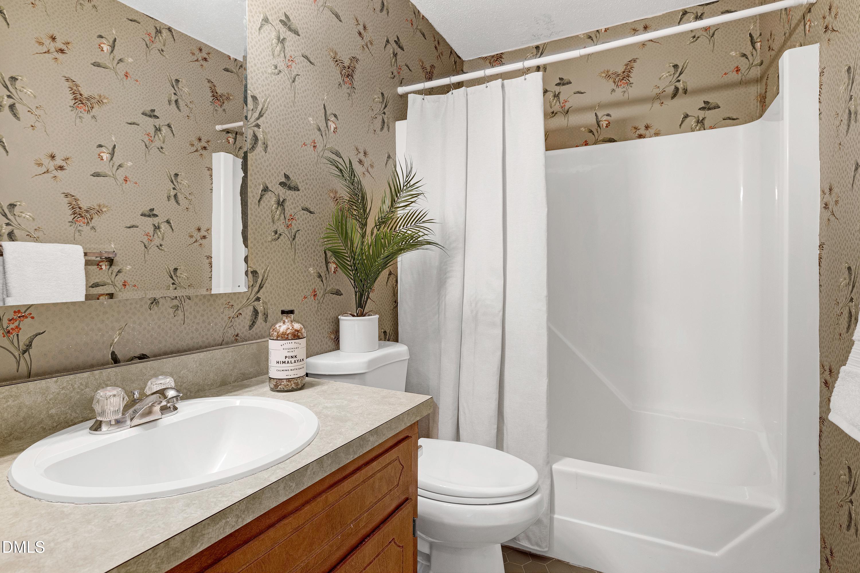 3905 Wendy Lane Raleigh, NC 27606 - Photo 31 of 42 a bathroom with a sink toilet and shower