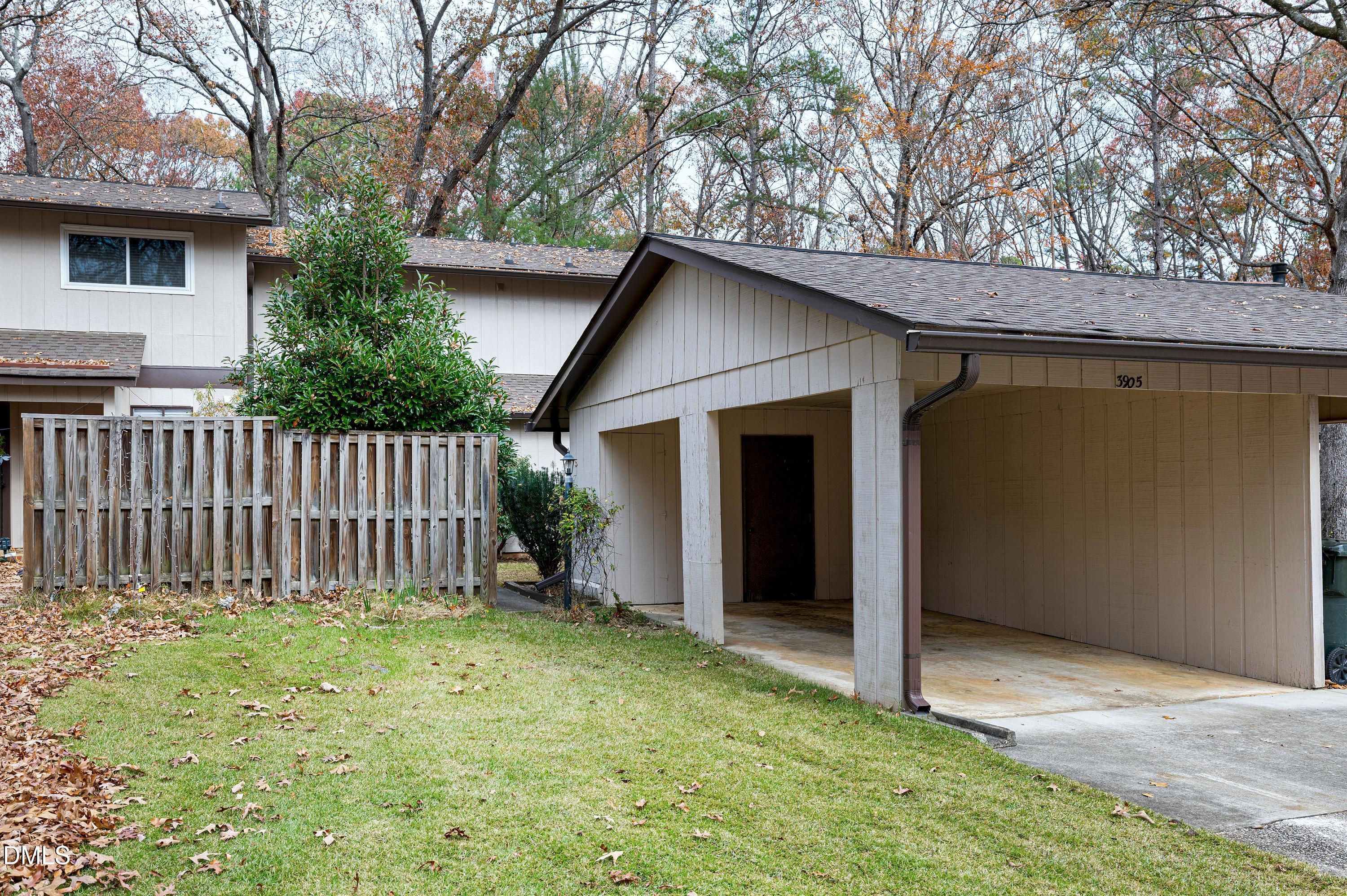 3905 Wendy Lane Raleigh, NC 27606 - Photo 34 of 42 a view of backyard of house with wooden fence