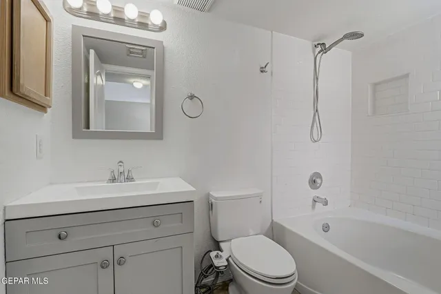 a bathroom with a toilet a sink and a bathtub