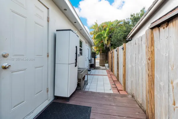 a close up of a utility room with dryer and washer