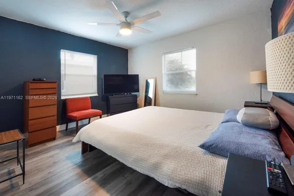 a bathroom with a sink a toilet and bathtub