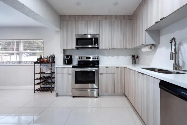 a view of swimming pool with a patio