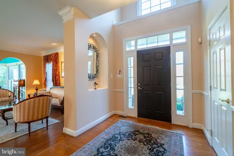 a view of a livingroom with furniture and hardwood floor
