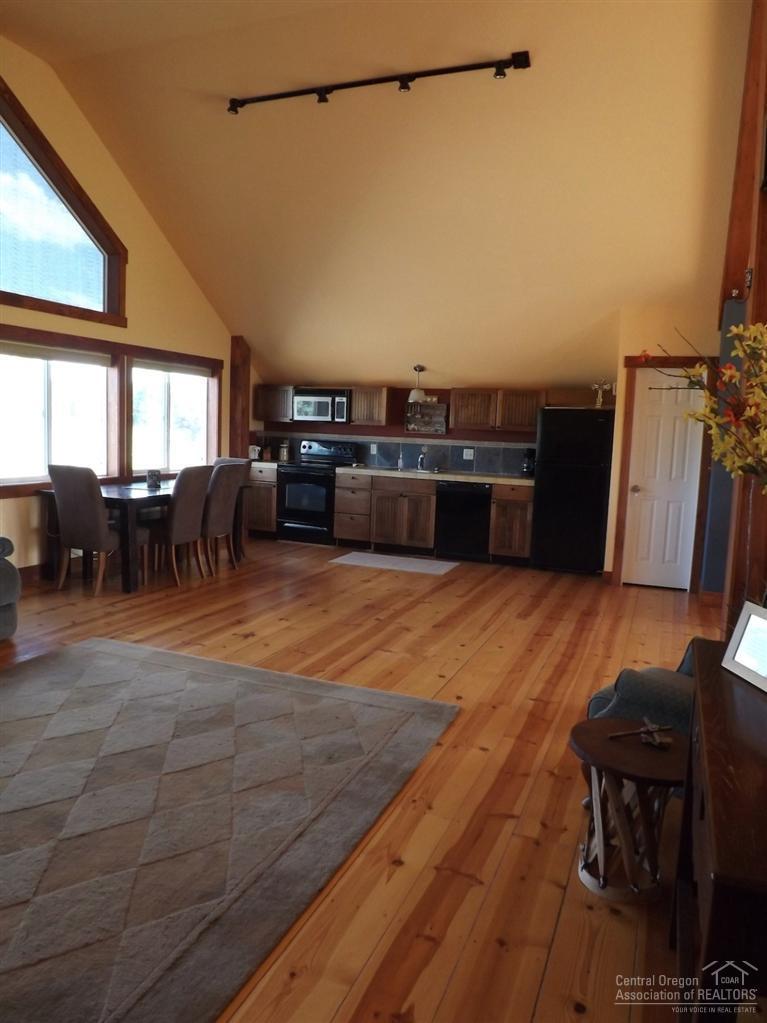 18665 Innes Market Road Bend, OR 97703 - Photo 16 of 23 a view of a living room and kitchen island